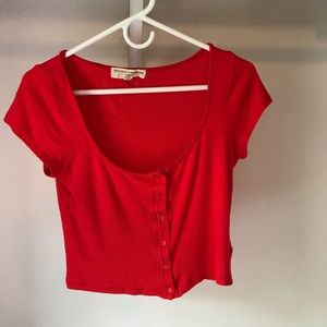 Red buttoned u-neck tee